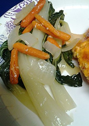 A picture of Bok choy, onion and carrots.