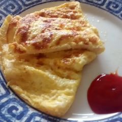 A picture of 3 egg and cheese omelette.