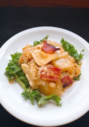 Una foto de Papas con queso brie o Tartiflette