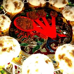 A picture of Idli with date palm jaggery-Coconut filling.