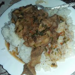 A picture of Stewed beef with plain rice.