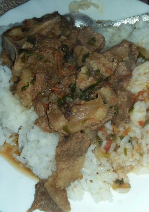 A picture of Stewed beef with plain rice.