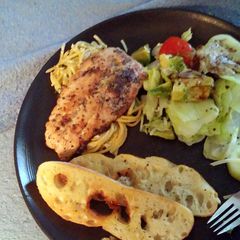 A picture of Pan seared Salmon with Garlic lemon pasta.
