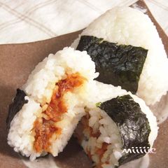 A picture of Rice Balls with Umeboshi and Bonito Flakes.