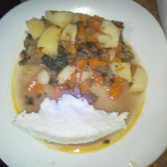 A picture of Fried beef served with ugali.