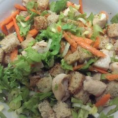 A picture of Chicken salad with bread.