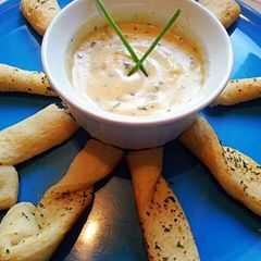 A picture of Ray's' Beer Cheesy dipper & garlic herb bread sticks.