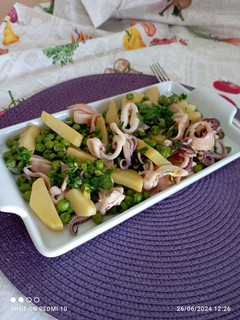 A picture of Salad with Potatoes, Peas, and Calamari.