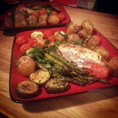 A picture of Salmon with roast asparagus, potatoes etc..
