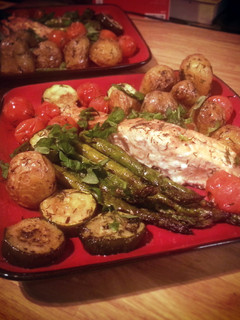 A picture of Salmon with roast asparagus, potatoes etc..
