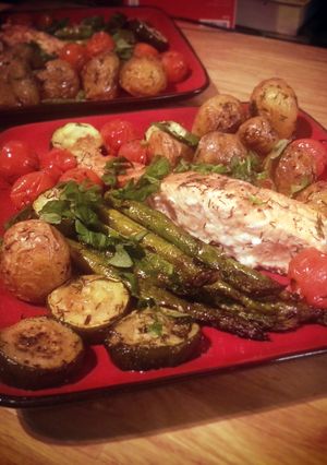 A picture of Salmon with roast asparagus, potatoes etc..