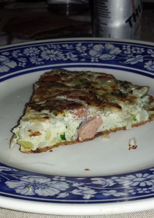 A picture of Onion and sausage omelette.