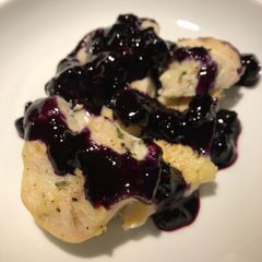 A picture of Lemon Pepper Chicken with a Blueberry Orange Wine Sauce.