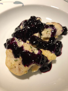 A picture of Lemon Pepper Chicken with a Blueberry Orange Wine Sauce.