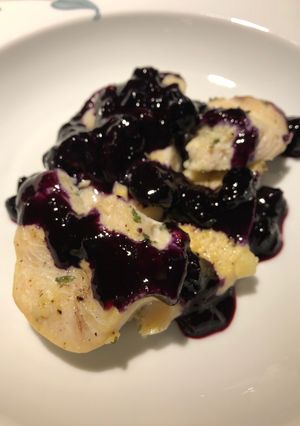 A picture of Lemon Pepper Chicken with a Blueberry Orange Wine Sauce.