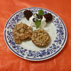 A picture of Caramel Vodka Apple Tartlets with a Pecan Strusel Topping.
