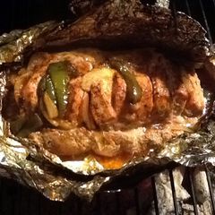A picture of Grilled Tenderloin With Peppers And Onions.