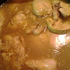 A picture of Chicken in sage onion turmeric sauce.