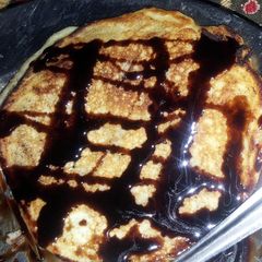 coconut pancakes with honey orange sauce A picture of coconut pancakes with honey orange sauce.
