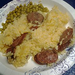 A picture of Sausage and buttery saffron rice.