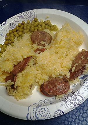 A picture of Sausage and buttery saffron rice.