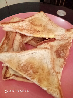 A picture of Toast bread with Sunnyside filling.