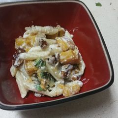 A picture of Penne with butternut squash and goat cheese.