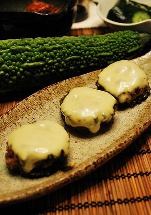 A picture of Bitter Melon Hamburgers Topped with Melted Cheese.