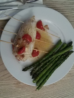A picture of Stuffed squid with asparagus and tapenade.