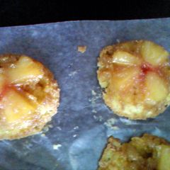 A picture of pineapple upside down individual cakes.