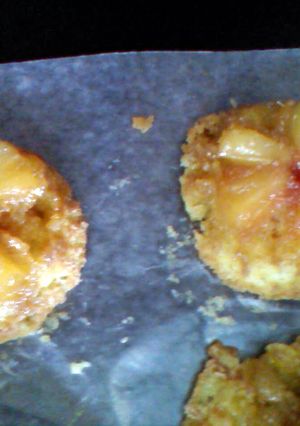 A picture of pineapple upside down individual cakes.
