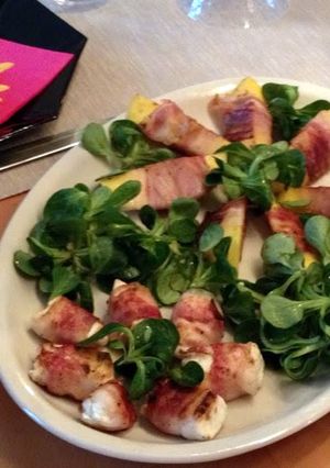 A picture of grilled mango with bacon.