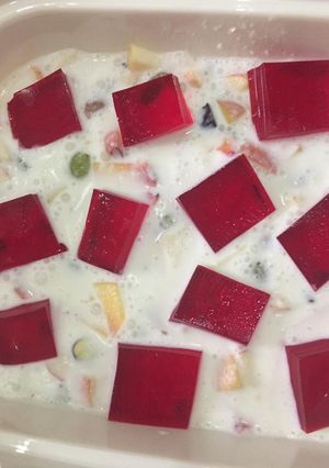A picture of Fruit and nuts with cream.