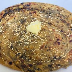 A picture of Til Masala Spicy Parantha.