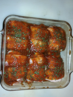 A picture of Bacon wrapped bbq chicken thighs.