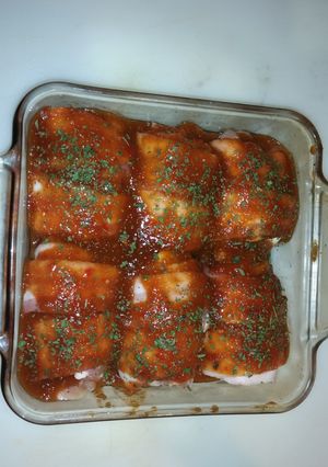 A picture of Bacon wrapped bbq chicken thighs.
