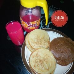 A picture of Pancakes and pink lemonade.