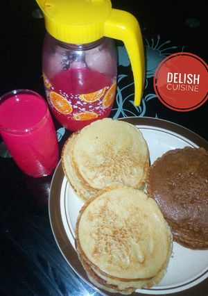 A picture of Pancakes and pink lemonade.