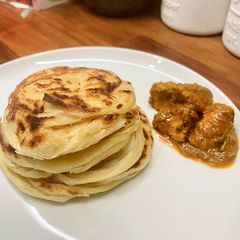 A picture of Roti Canai or Parotta.