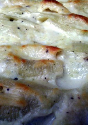 A picture of Stuffed Italian Shells with White Sauce.