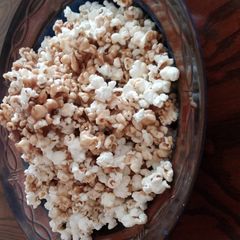 A picture of Caramel popcorn in a paper bag.