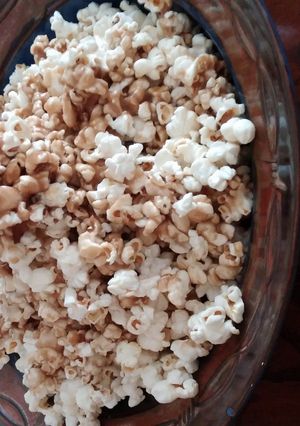 A picture of Caramel popcorn in a paper bag.
