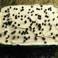 A picture of Cannoli Poke Cake.