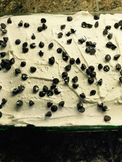 A picture of Cannoli Poke Cake.