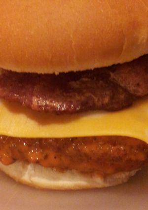 A picture of Buffalo chicken bacon sandwich with cheddar jack cheese.