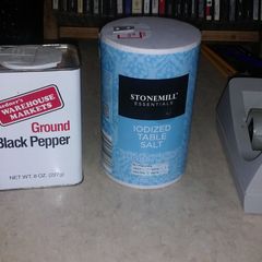 A picture of Easy tip to fill salt n pepper without making a mess.