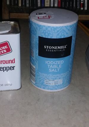 A picture of Easy tip to fill salt n pepper without making a mess.