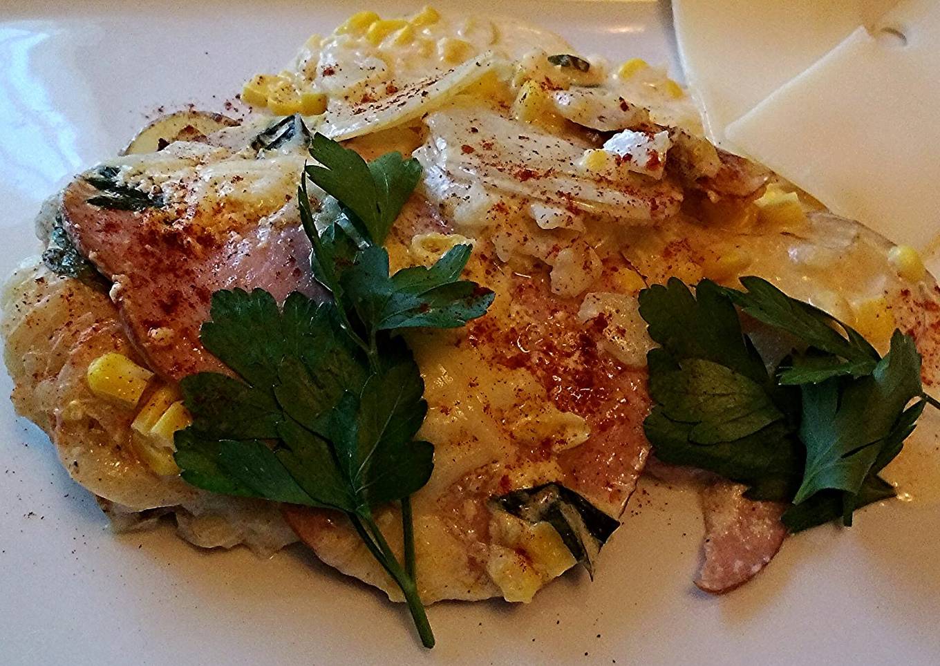 Potato gratin with ham in a frying pan