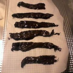 A picture of DARK CHOCOLATE COVERED BACON.