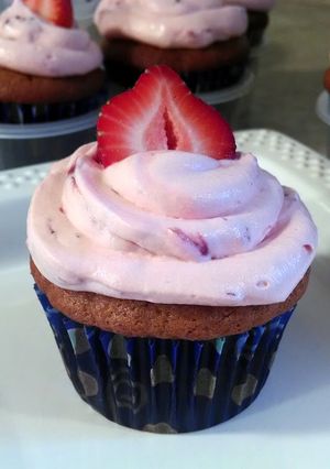 A picture of Banana Cupcakes with Strawberry Frosting.
